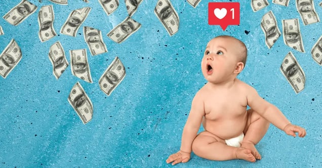 A baby in a diaper looking up at dollar bills falling from the sky with an Instagram “like” symbol over its head. 