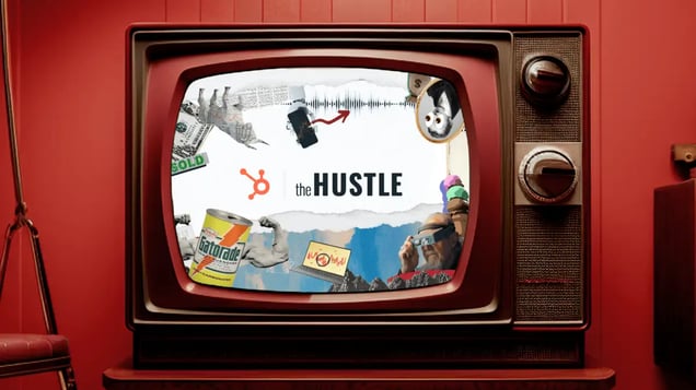 An old television against a red wall has a Hustle logo on screen.