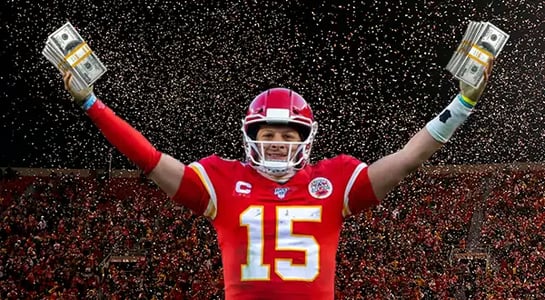 football player holding money